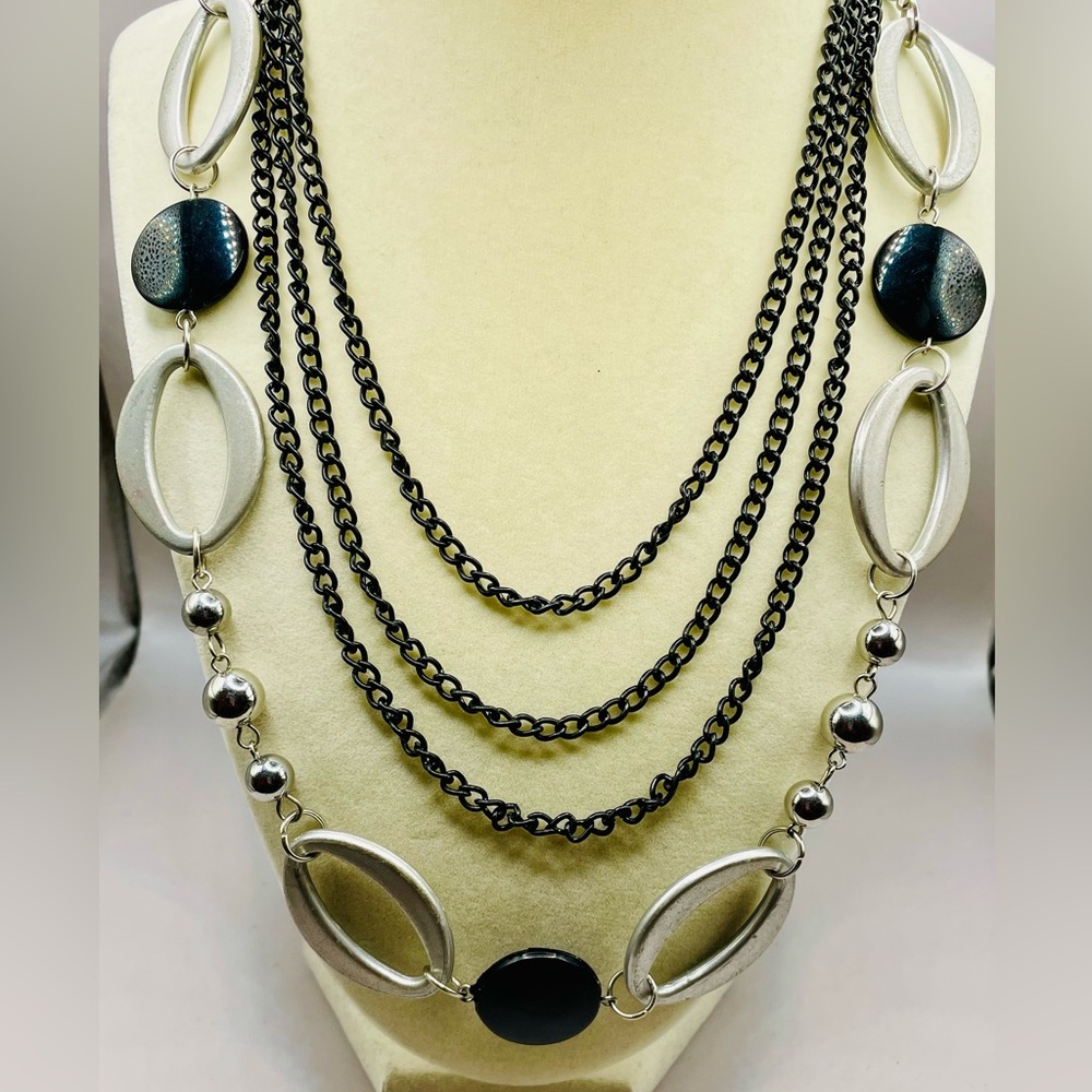 Multi strand layered black metal necklace with lucite silver bead and black disc